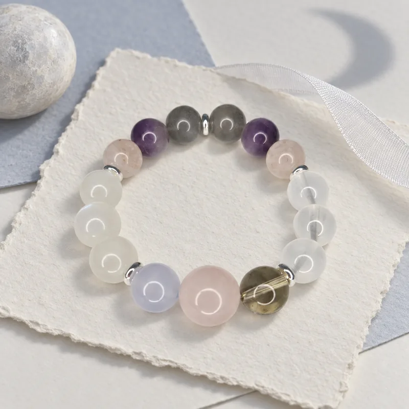 Moon-Phase Cycle bracelet styled on handmade paper